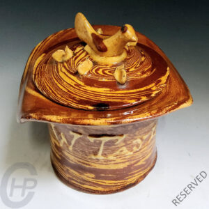 A Hen and Chickens Top Hat Slipware Tobacco Jar, Halifax, Yorkshire, England, 1877